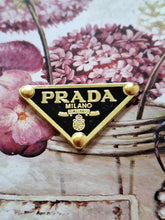 Load image into Gallery viewer, 38 mm PRADA ,patch,  pendant buttons, black,gold metal
